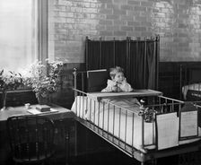 Child in the Hospital for Sick Children, Great Ormond Street, London, 1893. Artist: Bedford Lemere and Company