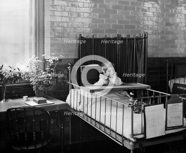 Child in the Hospital for Sick Children, Great Ormond Street, London, 1893. Artist: Bedford Lemere and Company.