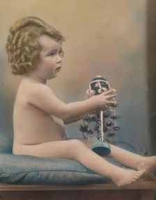 Child with toy, c1920
