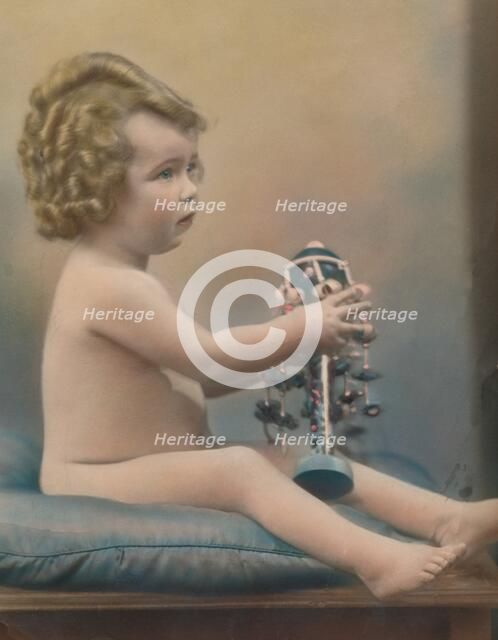 Child with toy, c1920. Artist: Unknown.