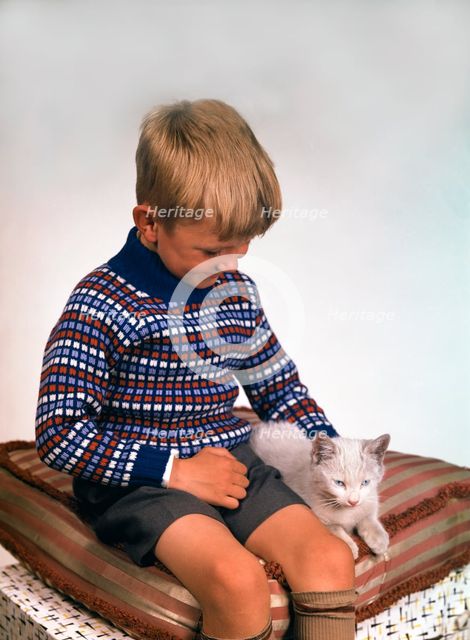 Child with a cat, 1963. Creator: Michael Walters.