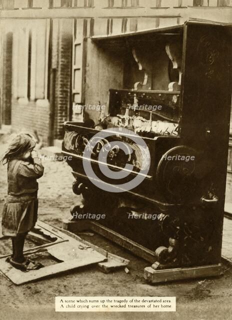 Child with damaged piano after an air raid made her homeless, First World War, 1918, (1935). Creator: Unknown.