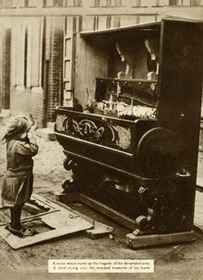 Child with damaged piano after an air raid made her homeless, First World War, 1918, (1935). Creator: Unknown