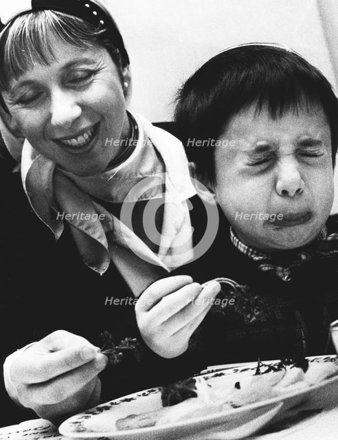 Child tasting bitter herbs at Passover, 1992. Creator: John Nathan.