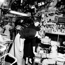 Child trying out a toy in a London toy store, c1950s. Artist: Henry Grant