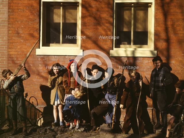 Children aiming sticks as guns, lined up against a brick building, Washington, D.C.?, 1941-1942. Creator: Unknown.