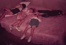 Children asleep on bed during square dance, McIntosh County, Okla., 1939 or 1940. Creator: Russell Lee