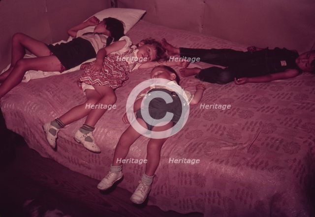 Children asleep on bed during square dance, McIntosh County, Okla., 1939 or 1940. Creator: Russell Lee.