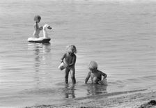 Children bathing in the Öresund, Bostahusen, Landskrona, Sweden 1966. Creator: Unknown