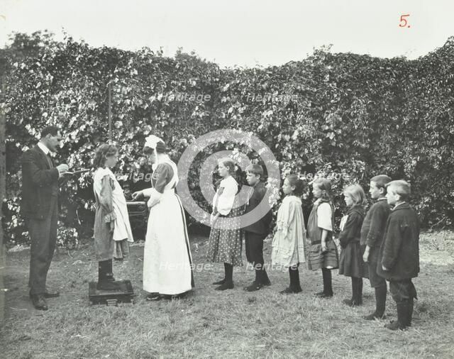 Children being weighed in the garden, Montpelier House Open Air School, London, 1908. Artist: Unknown.