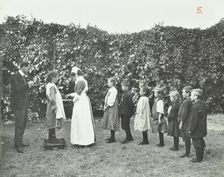 Children being weighed in the garden, Montpelier House Open Air School, London, 1908