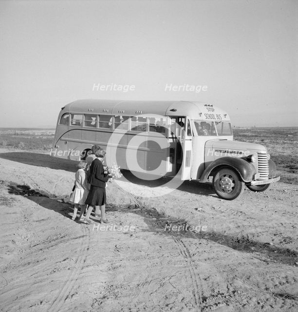Children get into school bus on a fall morning, Dead Ox Flat, Malheur County, Oregon, 1939 Creator: Dorothea Lange.