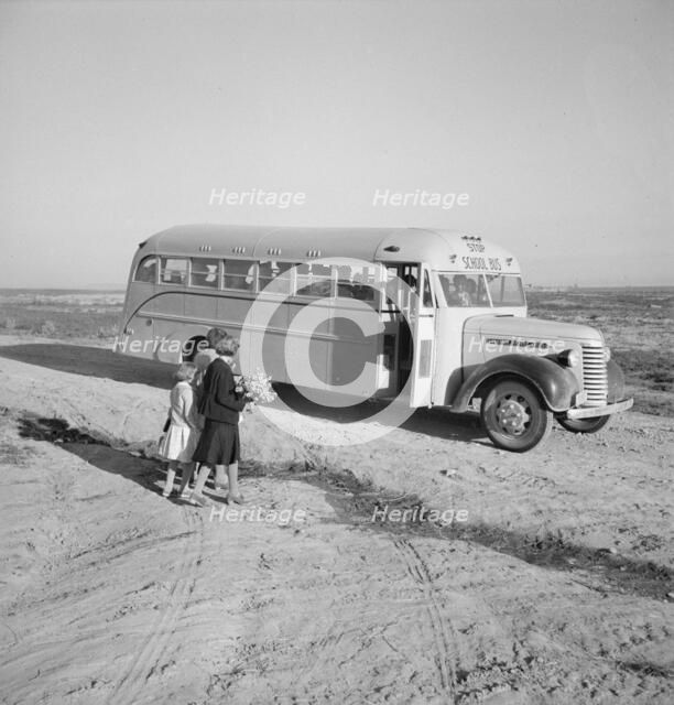 Children get into school bus on a fall morning, Dead Ox Flat, Malheur County, Oregon, 1939 Creator: Dorothea Lange.