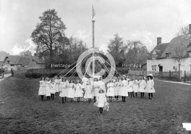 Children dance around the village maypole, East Hanney, Oxfordshire, c1860-c1922. Artist: Henry Taunt