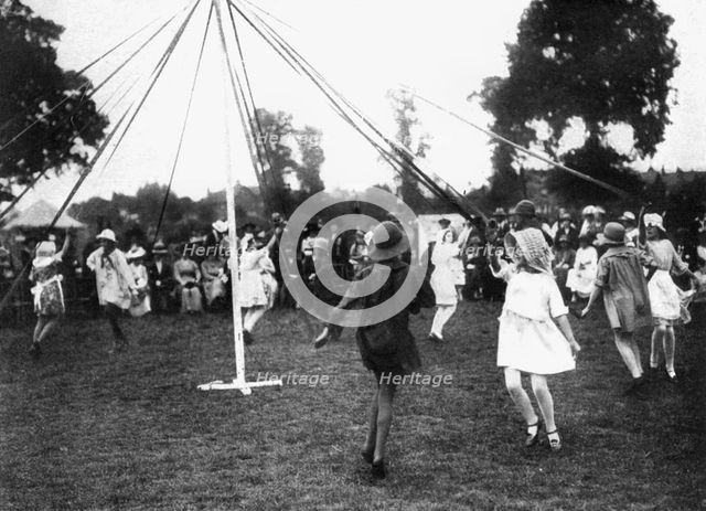 Children dancing round a maypole, 1926. Artist: Unknown