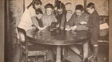 Children emptying their money-boxes to invest in war loan c1917, (1935)