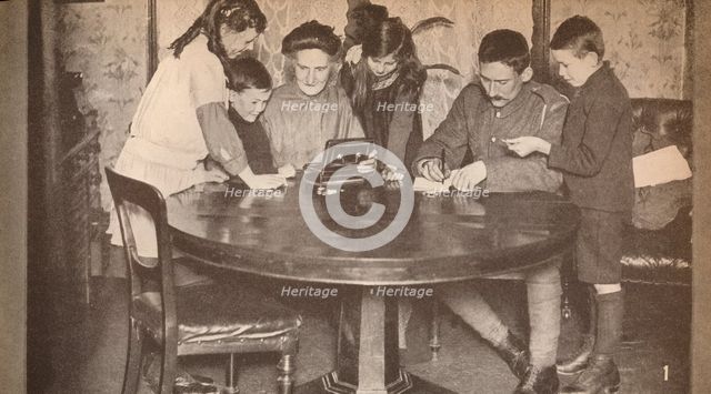 'Children emptying their money-boxes to invest in war loan', c1917, (1935). Artist: Unknown.