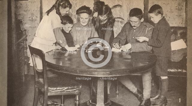 'Children emptying their money-boxes to invest in war loan', c1917, (1935). Artist: Unknown.