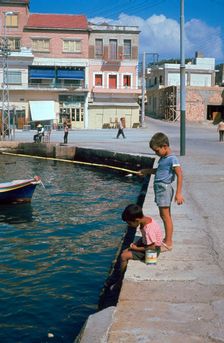 Children fishing in the harbour of Khania
