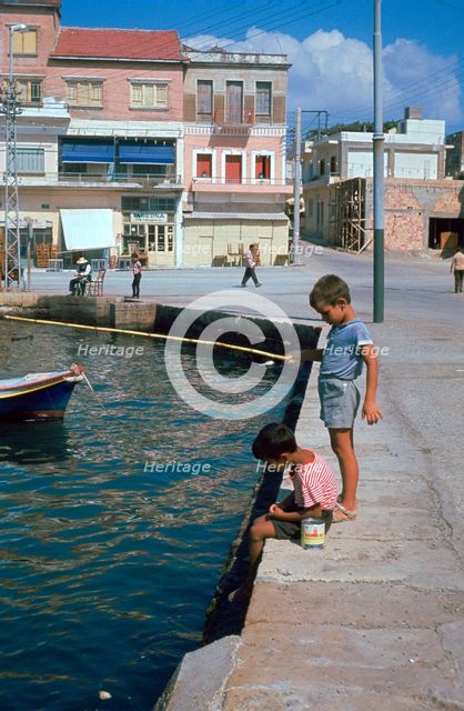 Children fishing in the harbour of Khania. Artist: Unknown