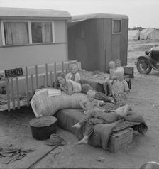 Children from Chickasaw, Oklahoma, in a potato pickers camp near Shafter, California, 1937. Creator: Dorothea Lange