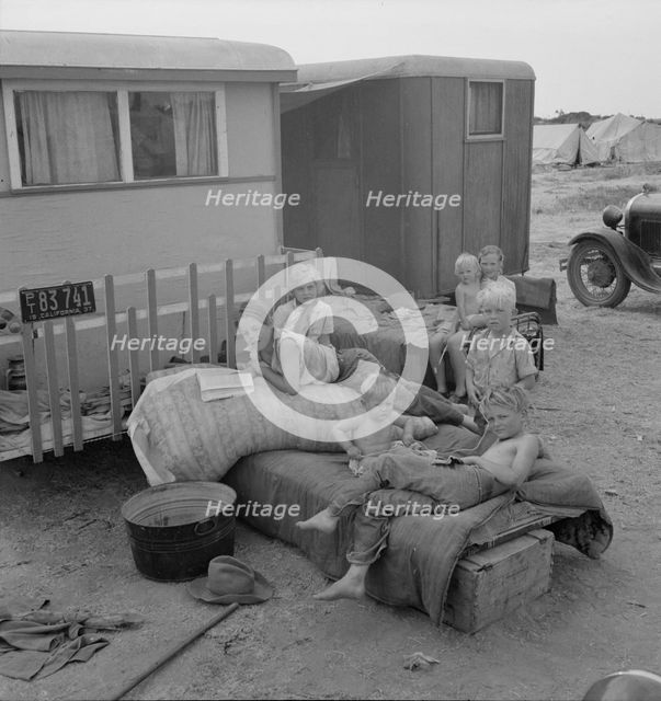 Children from Chickasaw, Oklahoma, in a potato pickers' camp near Shafter, California, 1937. Creator: Dorothea Lange.