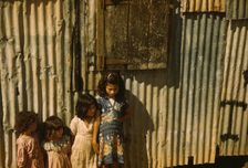 Children in a company housing settlement, Puerto Rico, 1941. Creator: Jack Delano
