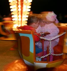 Children on a fairground ride, 2005. Creator: Peter Thompson
