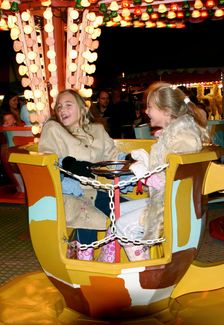 Children on a fairground ride, 2005. Creator: Peter Thompson