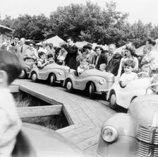 Children on a fairground ride, Festival of Britain, 1951. Creator: Henry Grant