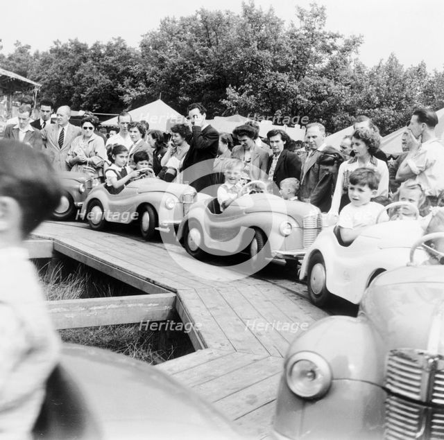 Children on a fairground ride, Festival of Britain, 1951. Creator: Henry Grant.