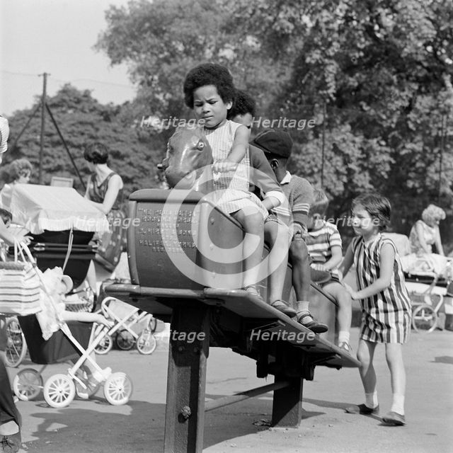 Children on a rocking horse, Clissold Park, Stoke Newington, London, 1962-1964. Creator: John Gay.