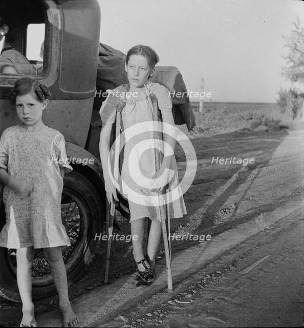 Children of Oklahoma drought refugees on highway near Bakersfield, California, 1935. Creator: Dorothea Lange.