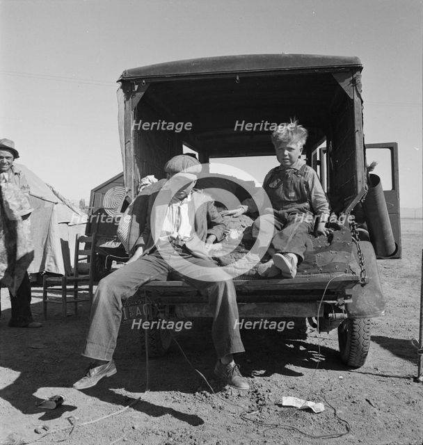 Children of Oklahoma migrants in agricultural workers' camp near Calipatria, California, 1937. Creator: Dorothea Lange.