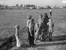 Children of migratory pea pickers in Brawley camp, California, 1939. Creator: Dorothea Lange