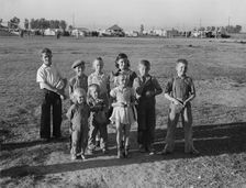 Children of migratory pea pickers in Brawley camp, California, 1939. Creator: Dorothea Lange