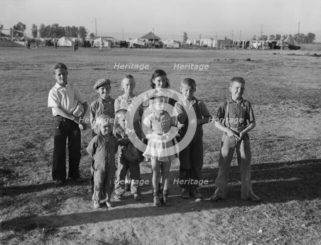 Children of migratory pea pickers in Brawley camp, California, 1939. Creator: Dorothea Lange.