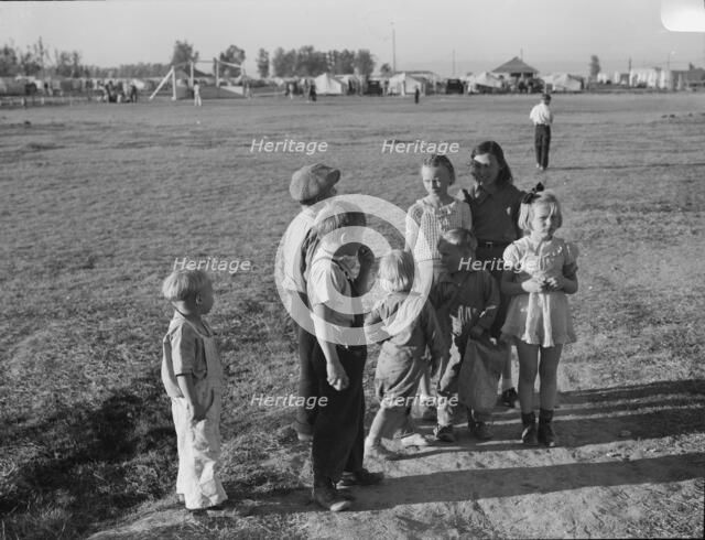Children of migratory pea pickers in Brawley camp, California, 1939. Creator: Dorothea Lange.