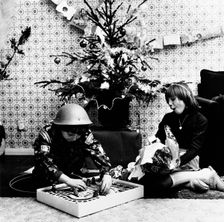 Children opening Christmas presents in their London home, c1960s. Creator: Henry Grant