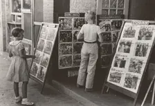 Children looking at posters in front of movie, Saturday, Steele, Missouri, 1938-08. Creator: Russell Lee