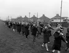Children marching with home made bugles, Middlesborough, Teesside,1964. Creator: Michael Walters