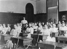 Children seated in classroom, Washington, D.C., (1899?). Creator: Frances Benjamin Johnston