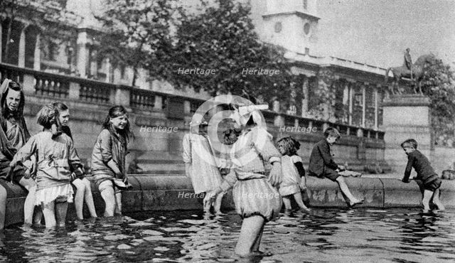 Children paddling in the fountains at Trafalgar Square, London, 1926-1927. Artist: Whiffin