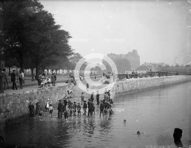 Children play ducks and drakes in the River Itchen, Southampton, Hampshire, c1878. Artist: Henry Taunt