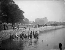 Children play ducks and drakes in the River Itchen, Southampton, Hampshire, c1878. Artist: Henry Taunt