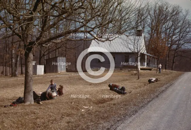 Children playing by road near school house, Kansas?, 1942 or 1943. Creator: John Vachon.