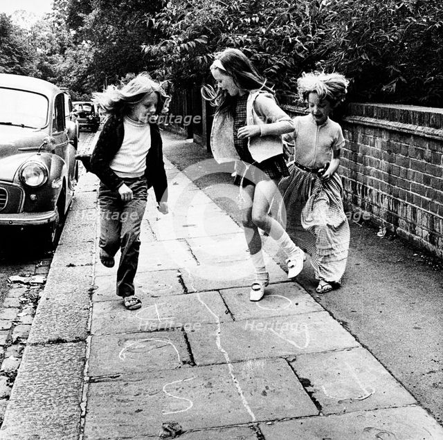 Children playing hopscotch on a London street, c1970. Creator: Henry Grant.