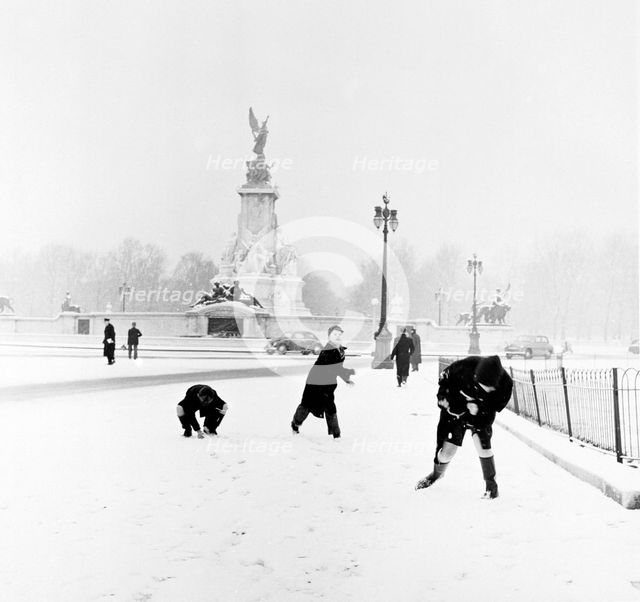 Children playing in the snow, London, 1957. Creator: Henry Grant.