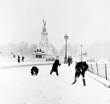 Children playing in the snow, London, 1957. Creator: Henry Grant