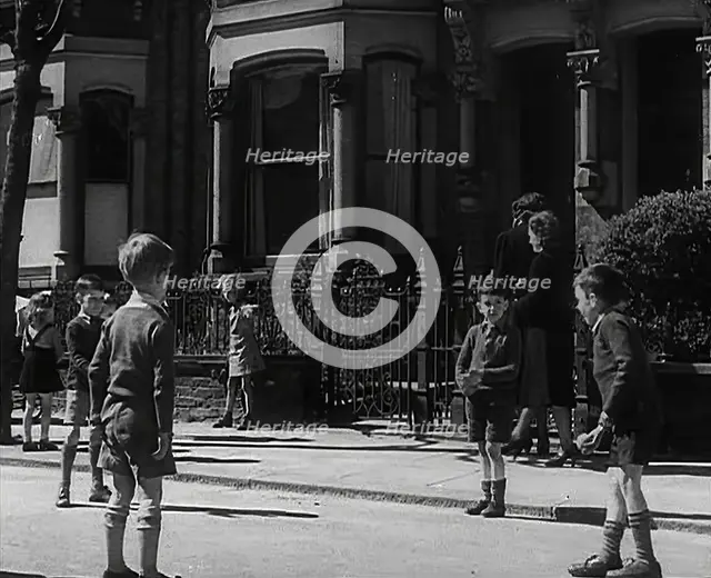 Children Playing in the Street, 1942. Creator: British Pathe Ltd.